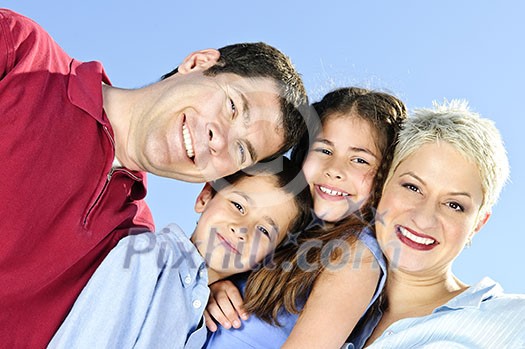 Portrait of happy family of four smiling
