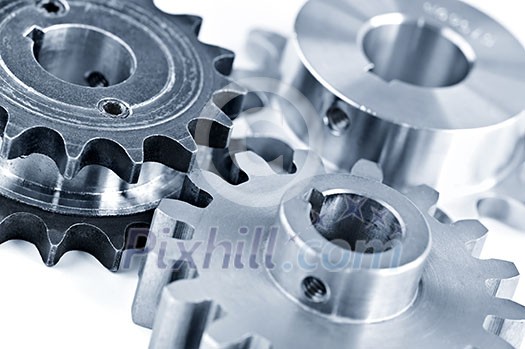 Interlocking industrial metal gears isolated on white Interlocking industrial metal gears isolated on white