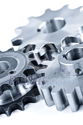 Interlocking industrial metal gears isolated on white Interlocking industrial metal gears isolated on white