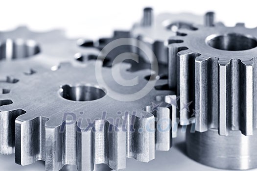 Interlocking industrial metal gears isolated on white Interlocking industrial metal gears isolated on white