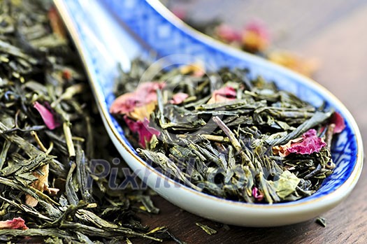 Green tea loose dry leaves in a spoon Green tea loose dry leaves in a spoon