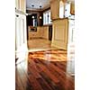 Hardwood and tile floor in residential home kitchen and dining room