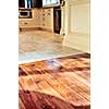 Hardwood and tile floor in residential home kitchen and dining room