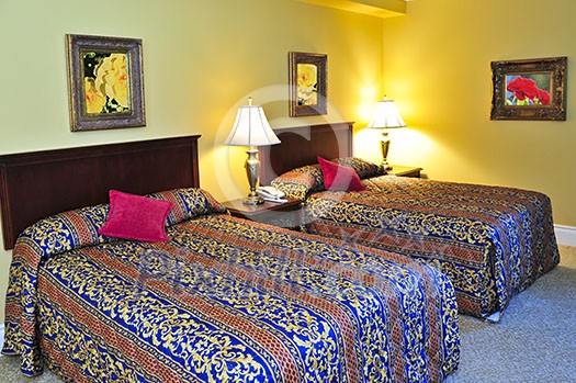 Bedroom interior with two double beds, images on the wall are my own. Bedroom interior with two double beds, images on the wall are my own.