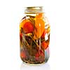 Clear glass jar of colorful pickled vegetables