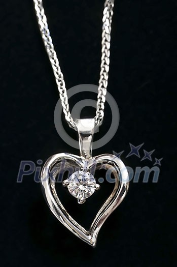 White gold heart pendant with diamond on a chain White gold heart pendant with diamond on a chain