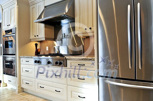 Interior of modern luxury kitchen with stainless steel appliances