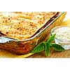 Fresh baked lasagna casserole with grated parmesan cheese
