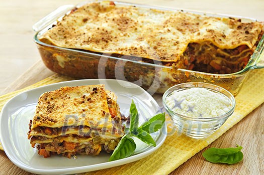 Fresh baked lasagna casserole with a serving cut