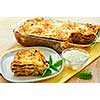 Fresh baked lasagna casserole with a serving cut
