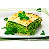 Serving of fresh baked vegeterian spinach lasagna on a plate