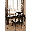 Antique chair and desk near the window in living room