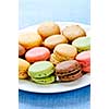Fresh multicolored macaroon cookies served on a plate