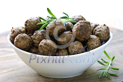 Fresh hot meatball appetizers served in white bowl