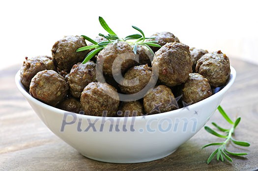 Fresh hot meatball appetizers served in white bowl Fresh hot meatball appetizers served in white bowl