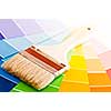Clean paintbrush on rainbow of color card samples