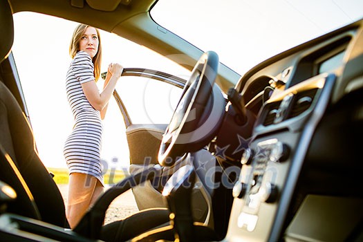 Portrait of a pretty, female teen driver, by her new car Portrait of a pretty, female teen driver, by her new car