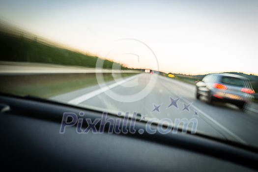 Cars moving fast on a highway (motion blurred image)