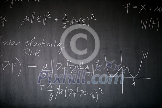 Blackboard with math lesson written on it Blackboard with math lesson written on it