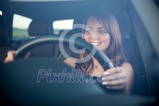 Cute teenager driving her brand new car Cute teenager driving her brand new car