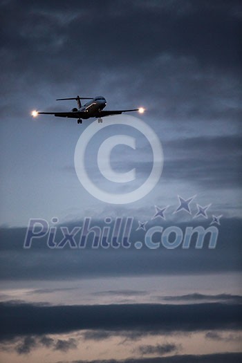 Passenger Airliner flying in the clouds