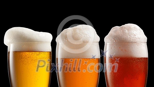 Different beer in glasses isolated on black background. Header for website Different beer in glasses isolated on black background. Header for website