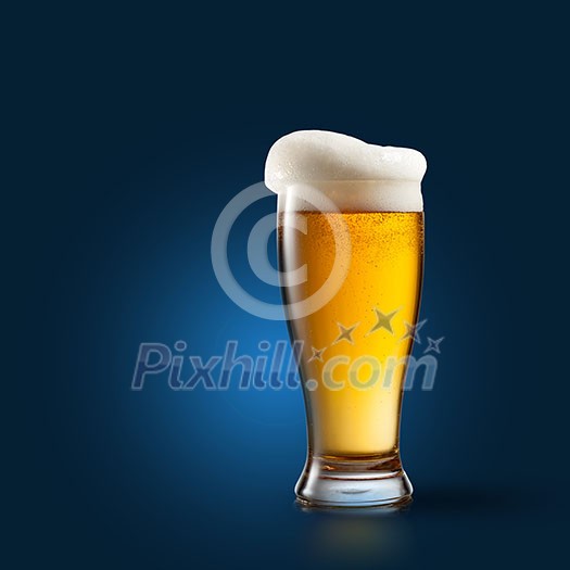 Beer in glass on blue background Beer in glass on blue background