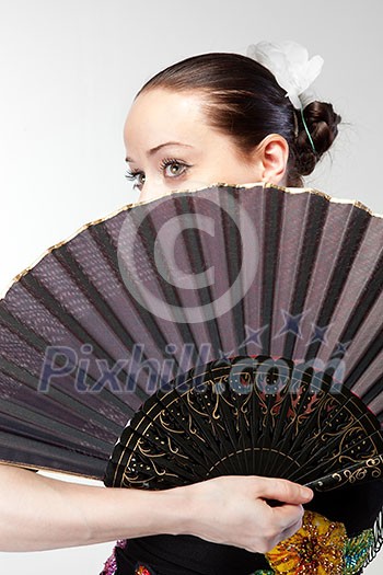 closeup portrait of flamenco dancer with fan closeup portrait of flamenco dancer with fan