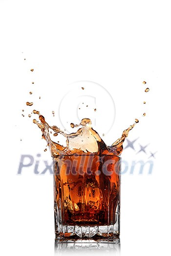 splash of cola in glass isolated on white