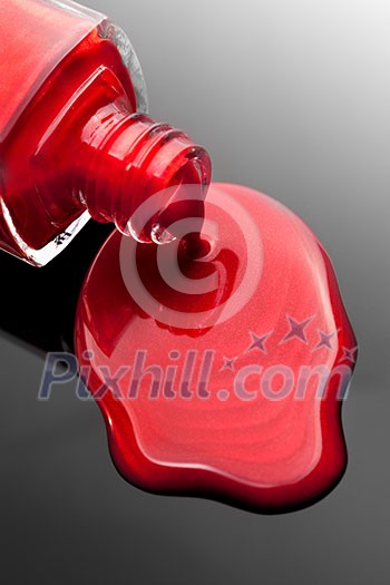 red nail polish bottle