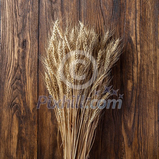 wheat on wooden background. top view