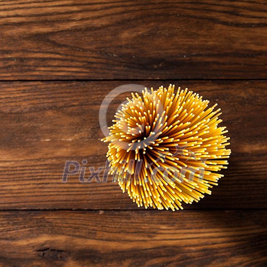 italian spaghetti on wooden background. Top view