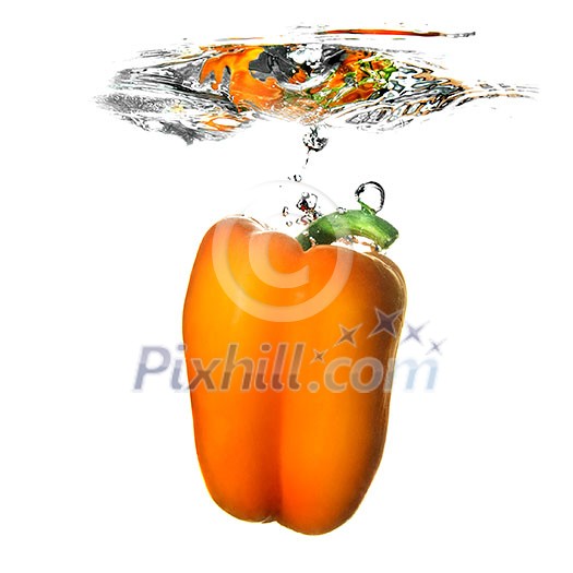 Yellow pepper dropped into water with bubbles isolated on white