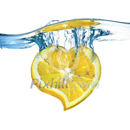 heart from lemon dropped into water isolated on white
