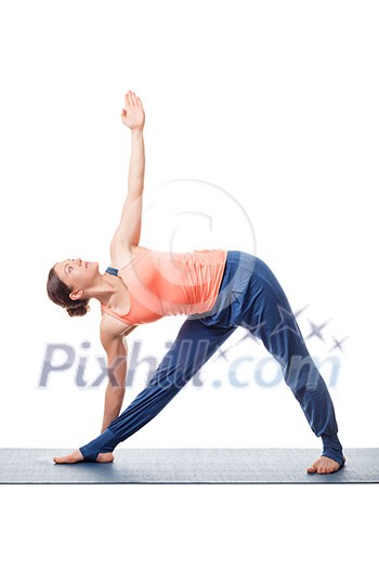Beautiful sporty fit yogini woman practices yoga asana utthita trikonasana - extended triangle pose isolated on white background Beautiful sporty fit yogini woman practices yoga asana utthita trikonasana - extended triangle pose isolated on white background