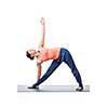 Beautiful sporty fit yogini woman practices yoga asana utthita trikonasana - extended triangle pose isolated on white background