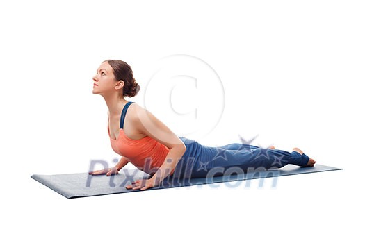 Beautiful sporty fit yogini woman practices yoga asana bhujangasana - cobra pose beginner variation isolated on white background Beautiful sporty fit yogini woman practices yoga asana bhujangasana - cobra pose beginner variation isolated on white background