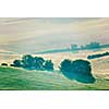 Vintage retro effect filtered hipster style image of Moravian rolling fields landscape in morning mist. Moravia, Czech Republic