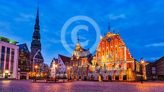 Panorama of Riga Town Hall Square, House of the Blackheads, St. Roland Statue and St. Peter's Church illuminated in the twilight, Riga, Latvia Panorama of Riga Town Hall Square, House of the Blackheads, St. Roland Statue and St. Peter's Church illuminated in the twilight, Riga, Latvia