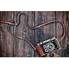 Photography concept  background - old retro vintage camera on grunge wooden texture