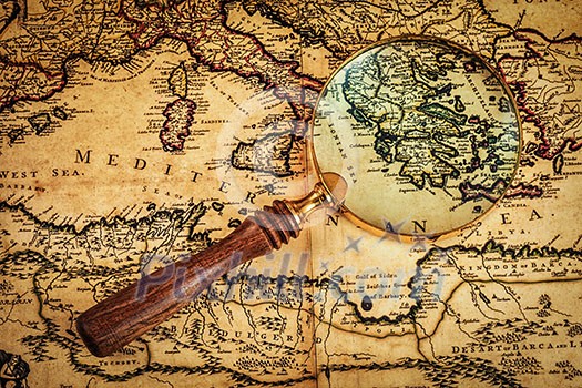 Travel geography navigation concept background - old vintage retro magnifying glass on ancient Mediterranean sea map Travel geography navigation concept background - old vintage retro magnifying glass on ancient Mediterranean sea map