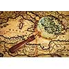 Travel geography navigation concept background - old vintage retro magnifying glass on ancient Mediterranean sea  map