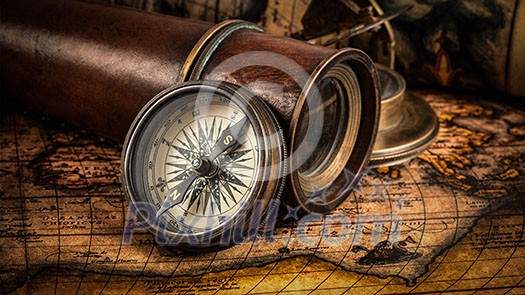 Travel geography navigation concept background - panorama of old vintage retro compass with sundial, spyglass and rope on ancient world map