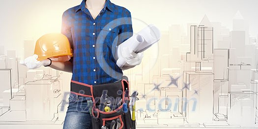 Bottom view of woman engineer with tool belt on waist Bottom view of woman engineer with tool belt on waist