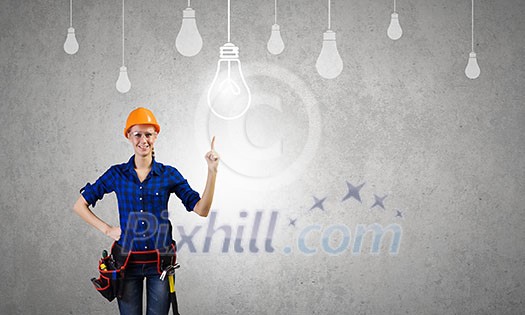 Young pretty woman engineer with tool belt on waist Young pretty woman engineer with tool belt on waist