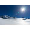 Mountain landscape with snow and clear blue sky