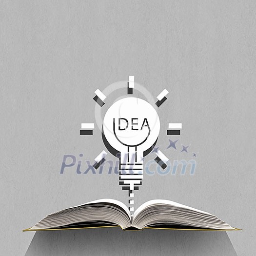 Opened book and idea light bulb on pages Opened book and idea light bulb on pages