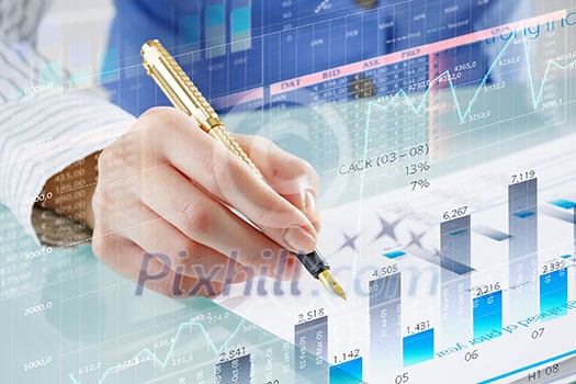 Businessman hand writing with pen and digital business infographs Businessman hand writing with pen and digital business infographs