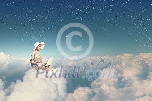 Woman in dress and hat sitting on cloud and working on laptop