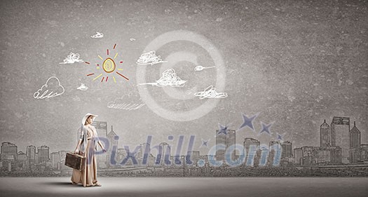 Beautiful woman walking with retro suitcase on cityscape background Beautiful woman walking with retro suitcase on cityscape background